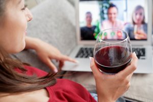 woman-drinking-wine-during-video-conference-with-f-2021-08-28-22-00-36-utc.jpg